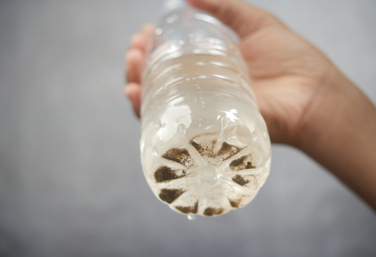 contaminated water bottle showing dark sediment 2026 01 07 01 25 27 utc