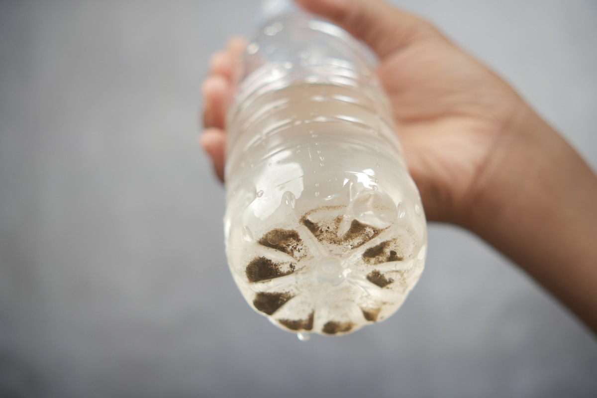contaminated water bottle showing dark sediment 2026 01 07 01 25 27 utc